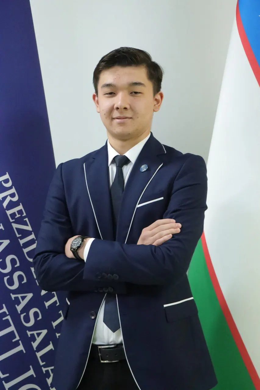 Between the flags of Uzbekistan and the Agency.