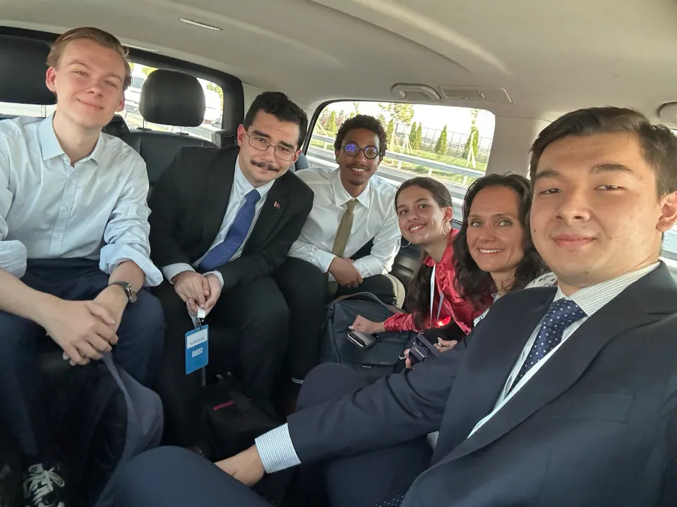 Taking international participants to meetings around the city.